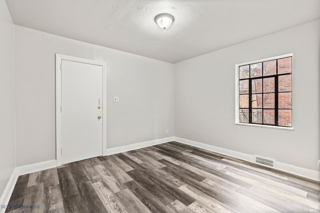 empty room featuring hardwood / wood-style flooring