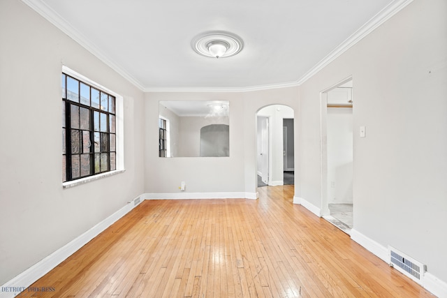 unfurnished room with crown molding and wood-type flooring