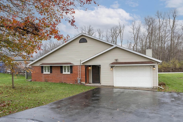 21734 N Channel Pkwy, Edwardsburg, MI 49112 - view of front facade featuring asphalt driveway, a chimney, a garage, and a front yard