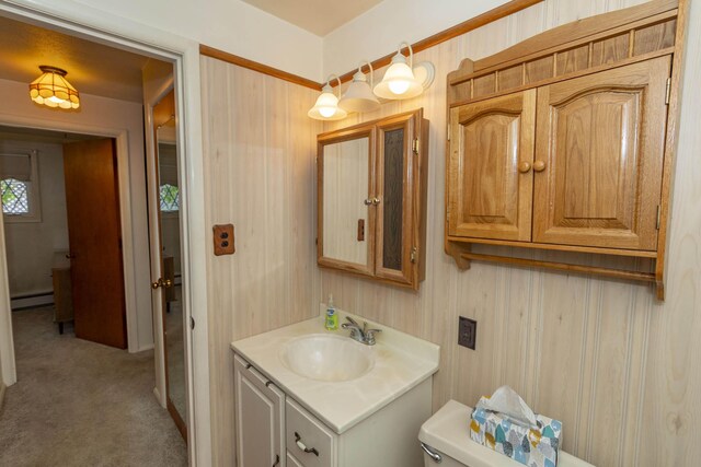 21734 N Channel Pkwy, Edwardsburg, MI 49112 - bathroom with a baseboard radiator, vanity, and toilet