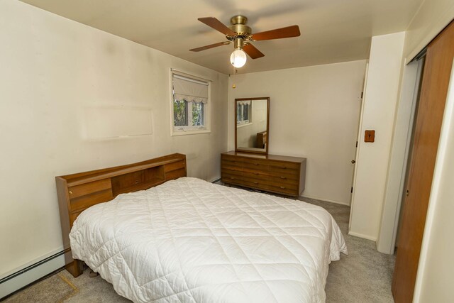 21734 N Channel Pkwy, Edwardsburg, MI 49112 - bedroom with a baseboard heating unit, carpet floors, ceiling fan, and a closet