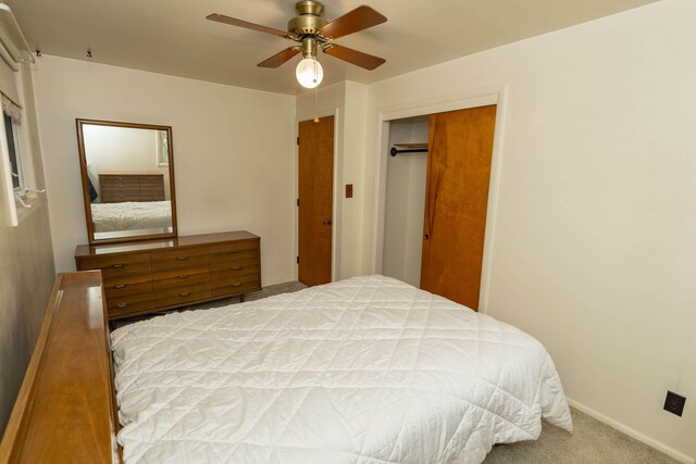 21734 N Channel Pkwy, Edwardsburg, MI 49112 - bedroom with carpet flooring, a closet, a ceiling fan, and baseboards