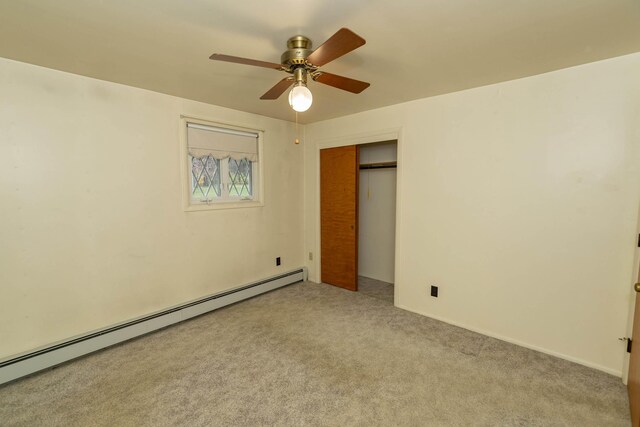 21734 N Channel Pkwy, Edwardsburg, MI 49112 - unfurnished bedroom featuring a baseboard radiator, carpet, a closet, and a ceiling fan
