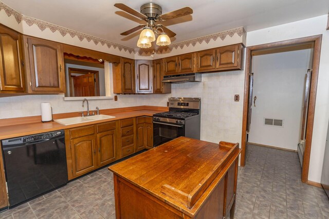 21734 N Channel Pkwy, Edwardsburg, MI 49112 - kitchen featuring black dishwasher, stainless steel gas range, a sink, under cabinet range hood, and butcher block counters