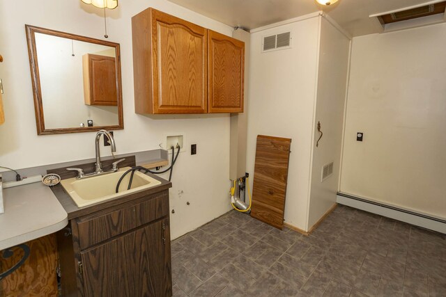 21734 N Channel Pkwy, Edwardsburg, MI 49112 - washroom featuring cabinet space, hookup for a washing machine, and a baseboard heating unit