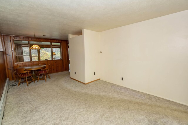 21734 N Channel Pkwy, Edwardsburg, MI 49112 - carpeted dining area with wooden walls and baseboards