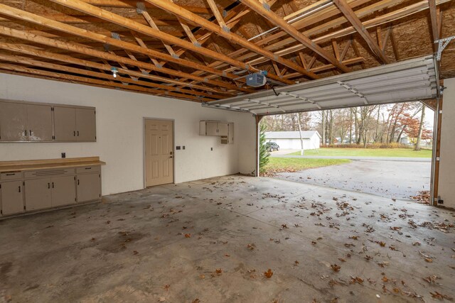 21734 N Channel Pkwy, Edwardsburg, MI 49112 - garage featuring a garage door opener