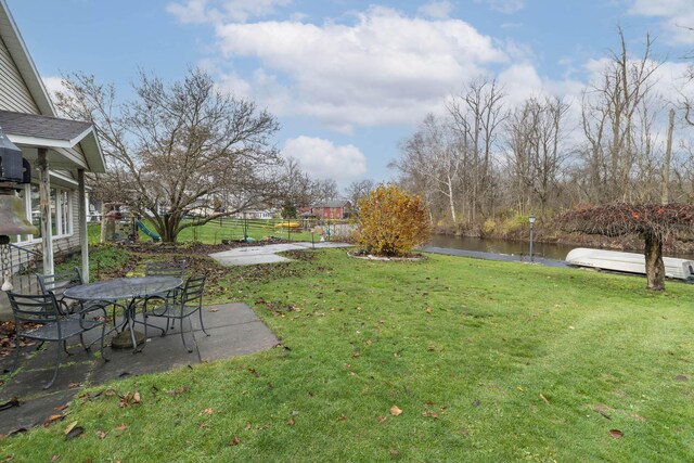 21734 N Channel Pkwy, Edwardsburg, MI 49112 - view of yard featuring a water view and a patio area