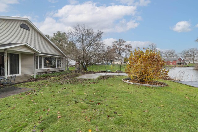 21734 N Channel Pkwy, Edwardsburg, MI 49112 - view of yard with a water view and a patio