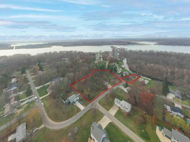 21734 N Channel Pkwy, Edwardsburg, MI 49112 - aerial view of property and surrounding area with a nearby body of water and property parcel outlined