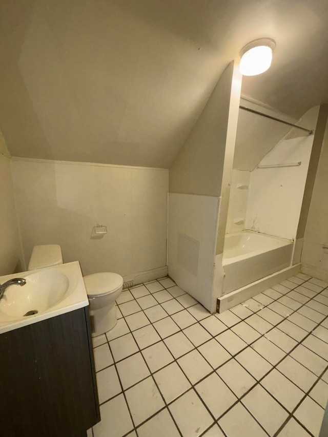 full bathroom featuring vanity, lofted ceiling, shower / tub combination, tile patterned flooring, and toilet