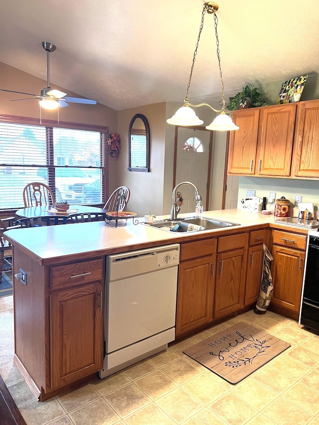 kitchen featuring ceiling fan, sink, white dishwasher, decorative light fixtures, and lofted ceiling