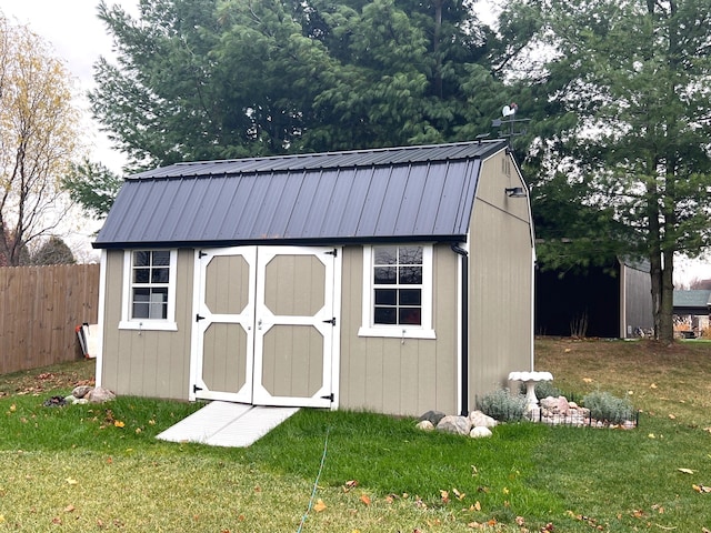 view of outdoor structure with a lawn