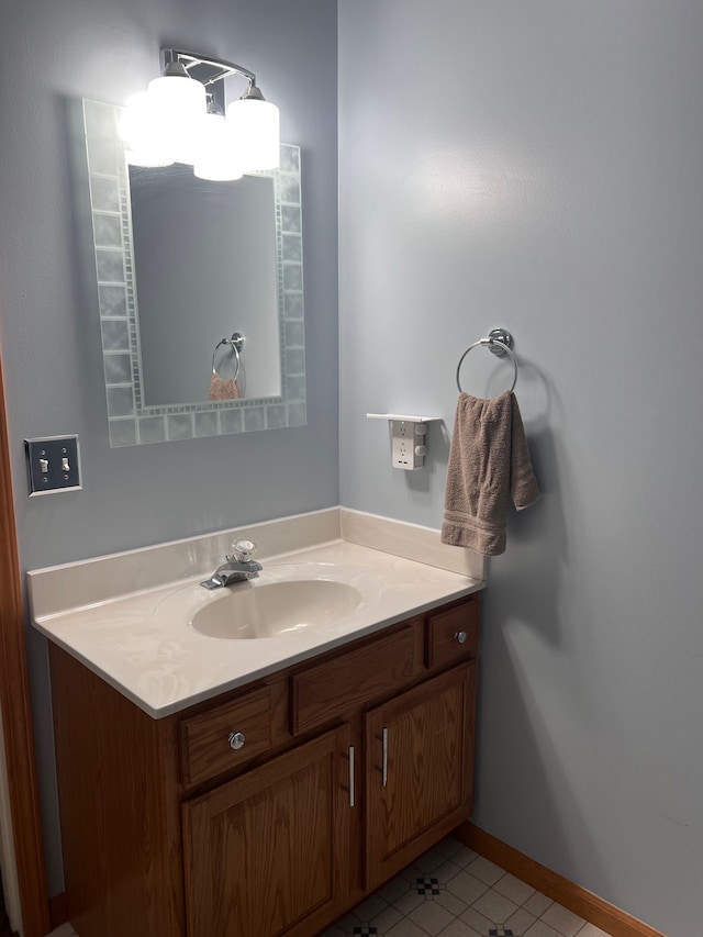 bathroom with tile patterned flooring and vanity