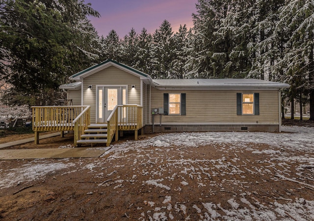 view of front of property featuring a wooden deck