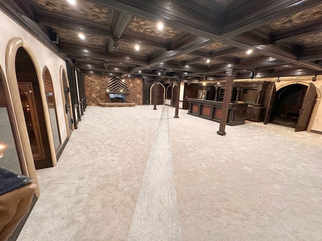 recreation room featuring beamed ceiling, light colored carpet, ornamental molding, and coffered ceiling