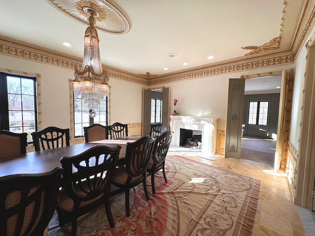 dining space featuring crown molding and a premium fireplace