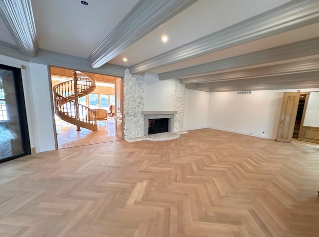 unfurnished living room featuring ornamental molding, a fireplace, beam ceiling, and light parquet floors