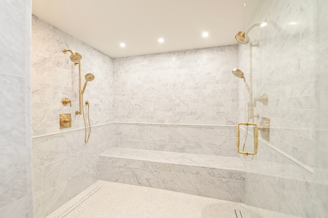 bathroom with tiled shower