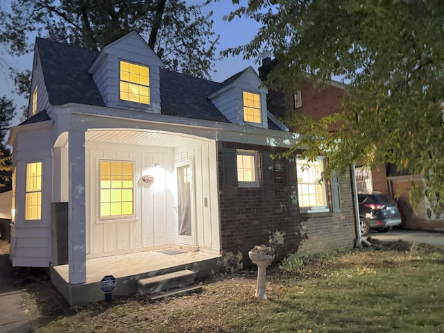 cape cod-style house with a porch