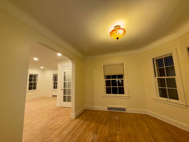 unfurnished room featuring hardwood / wood-style flooring