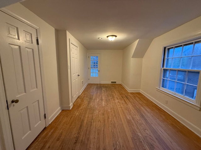 bonus room featuring hardwood / wood-style flooring