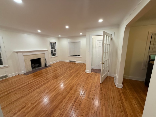 unfurnished living room with light hardwood / wood-style flooring