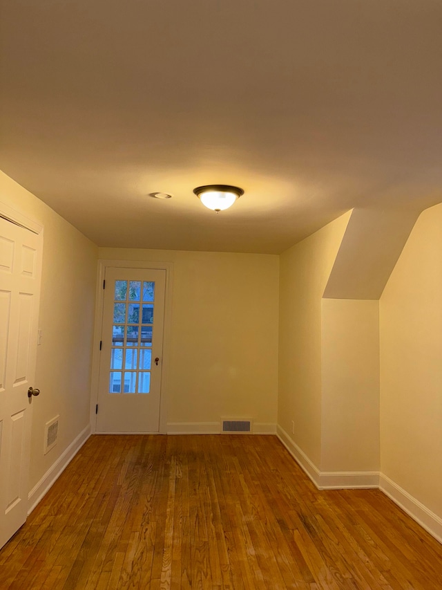 empty room featuring wood-type flooring