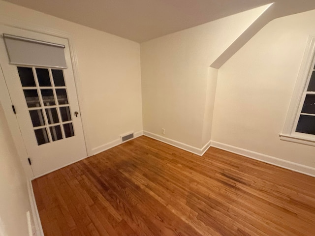 unfurnished room featuring wood-type flooring