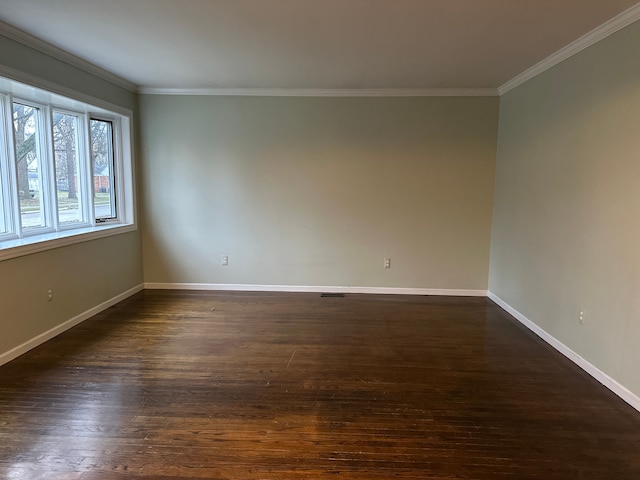 unfurnished room featuring crown molding and dark hardwood / wood-style floors