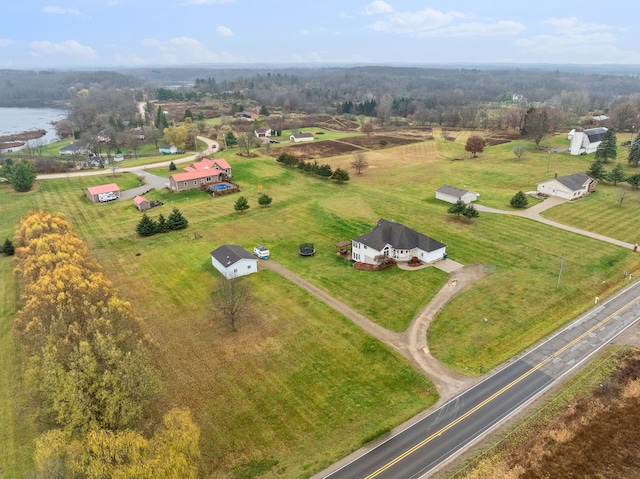 birds eye view of property featuring a rural view and a water view