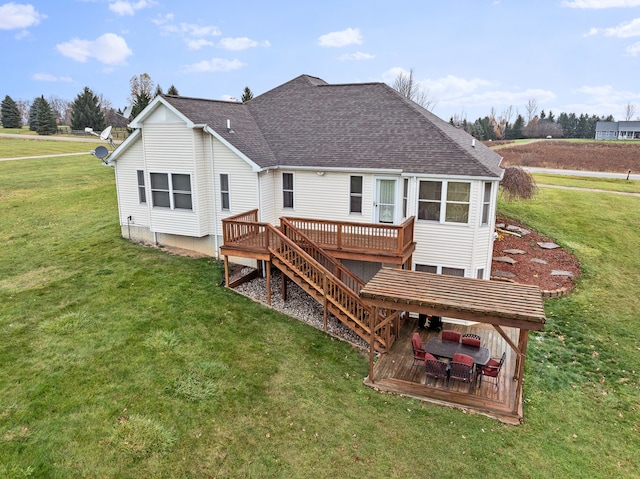 back of house with a lawn and a wooden deck