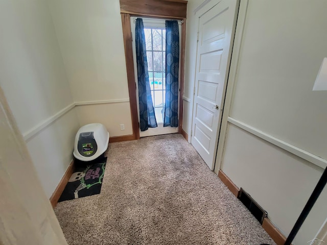 entryway featuring carpet floors