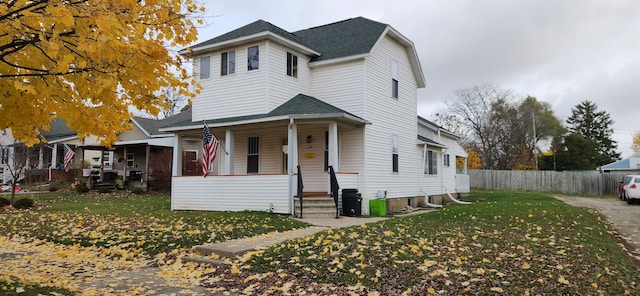 view of front of home featuring a porch and a front lawn