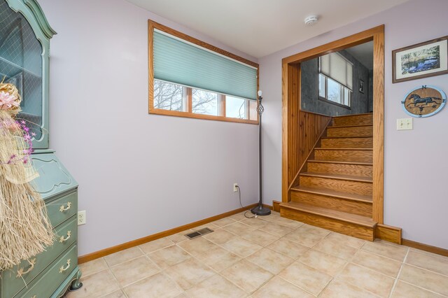 18980 16 Mile Rd, Marshall, MI 49068 - stairs featuring baseboards and tile patterned floors