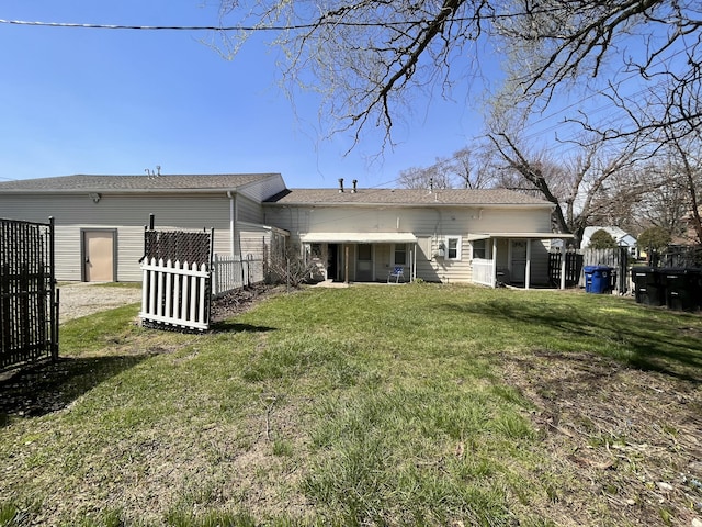 25846 W 7 Mile Rd, Redford, MI 48240 - back of property with a sunroom and a shingled roof