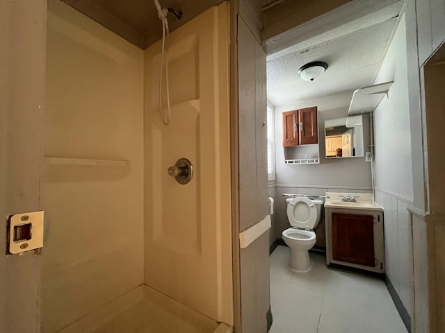 25846 W 7 Mile Rd, Redford, MI 48240 - full bath with a stall shower, toilet, vanity, wainscoting, and a textured ceiling