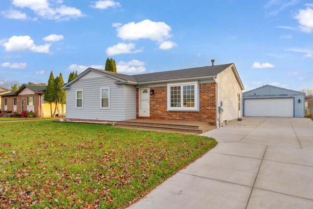 ranch-style house featuring a garage, an outbuilding, and a front yard