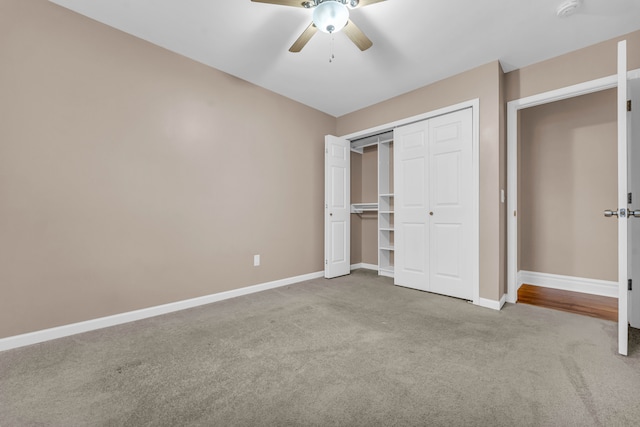 unfurnished bedroom with a closet, ceiling fan, and light colored carpet