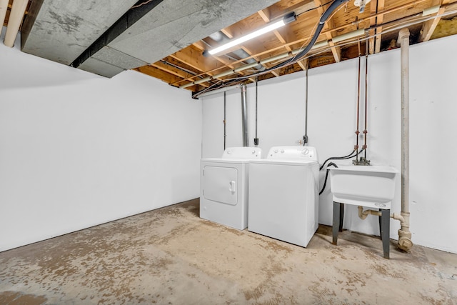 interior space featuring independent washer and dryer and sink