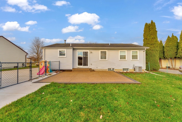 rear view of property with a yard and central air condition unit