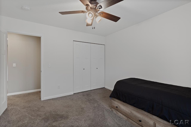 carpeted bedroom featuring a closet and ceiling fan