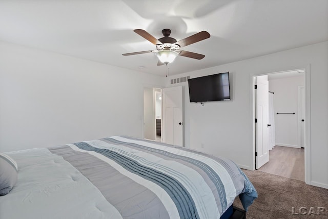 carpeted bedroom featuring ceiling fan