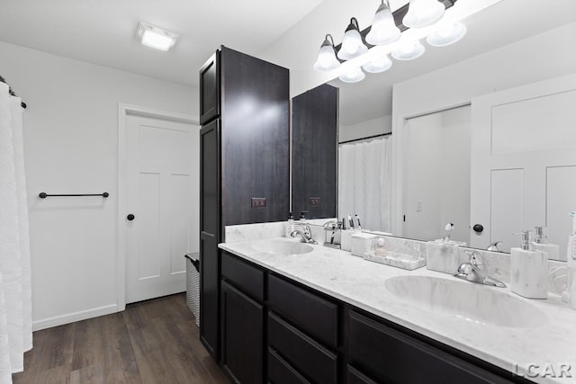 bathroom featuring vanity and wood-type flooring