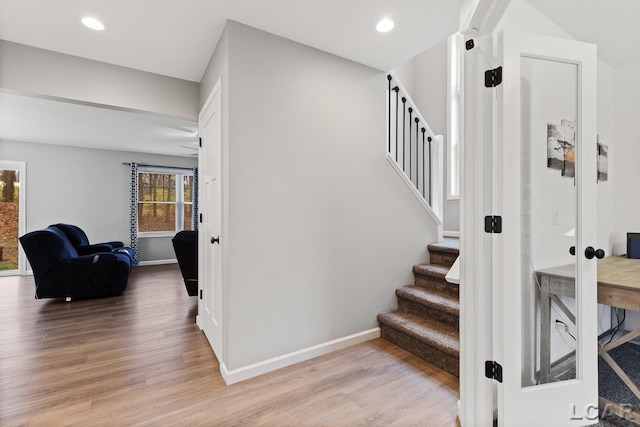 stairway featuring french doors and hardwood / wood-style flooring