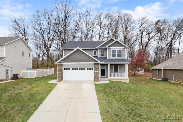 craftsman-style house with central AC unit, a garage, a porch, and a front yard