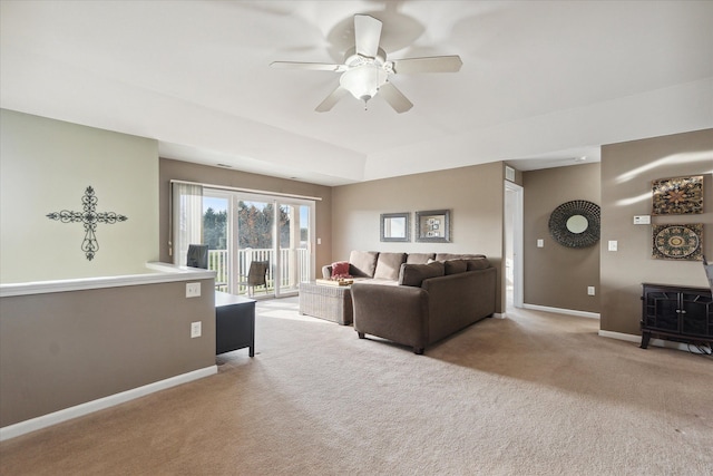 living room featuring ceiling fan and light colored carpet