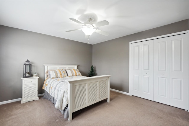 bedroom with carpet, a closet, and ceiling fan