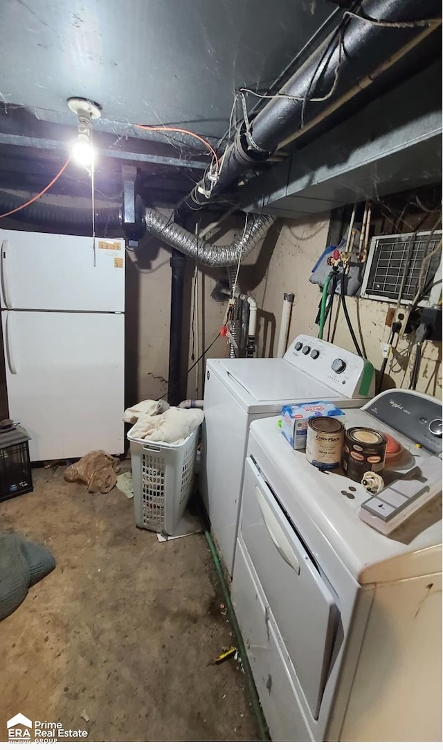 clothes washing area featuring washer and clothes dryer