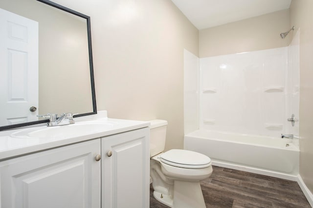 full bathroom with hardwood / wood-style floors, vanity, toilet, and shower / tub combination